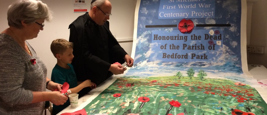 remembrance-putting-poppies-on-banner-img_2865